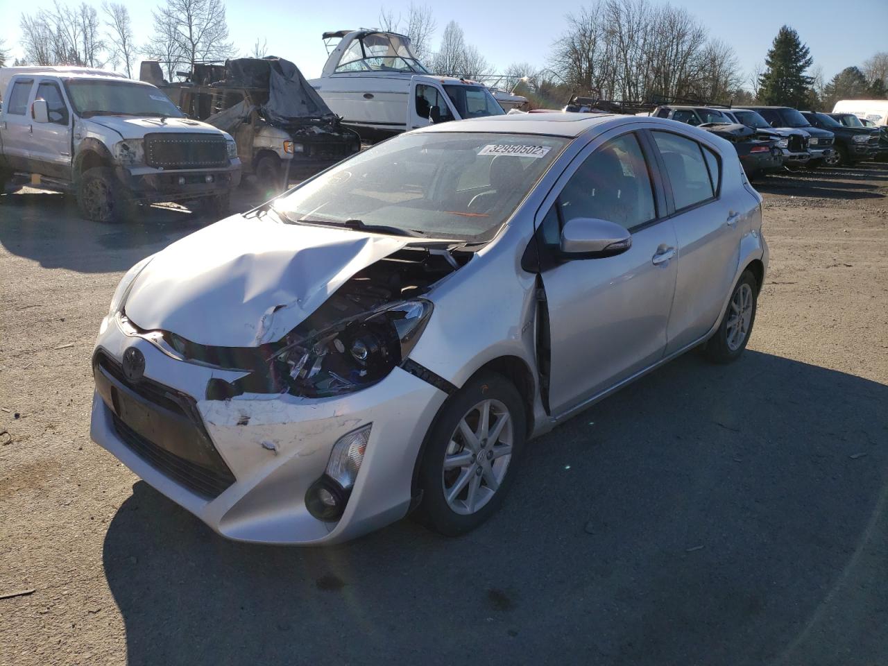 Photo 2 from auction – 2015 TOYOTA PRIUS C with VIN JTDKDTB31F1101640