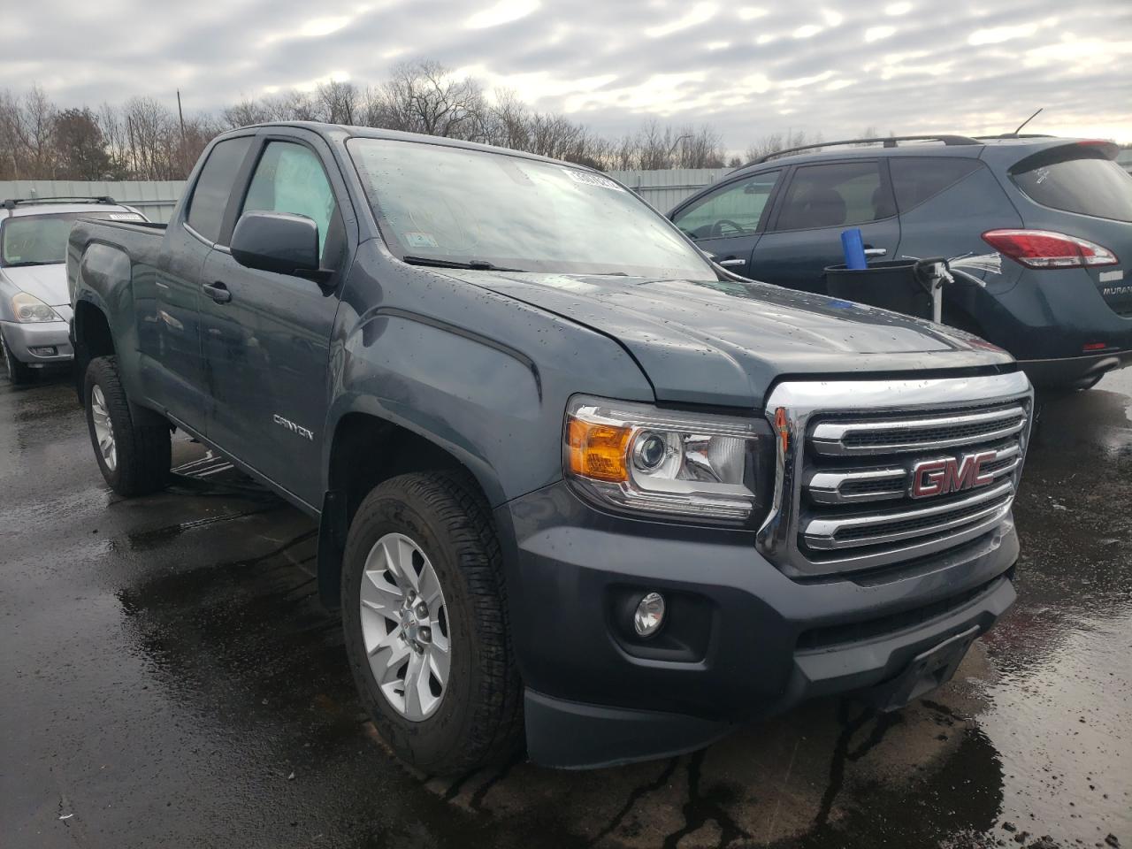 GMC CANYON SLE 2015 with VIN 1GTH5BE36F1166934 - Photo from auction