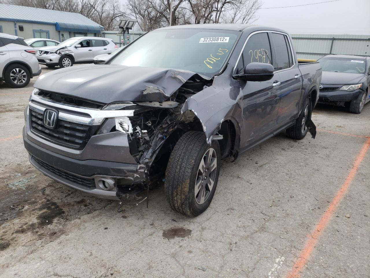 Photo 2 from auction – 2018 HONDA RIDGELINE with VIN 5FPYK3F77JB007234