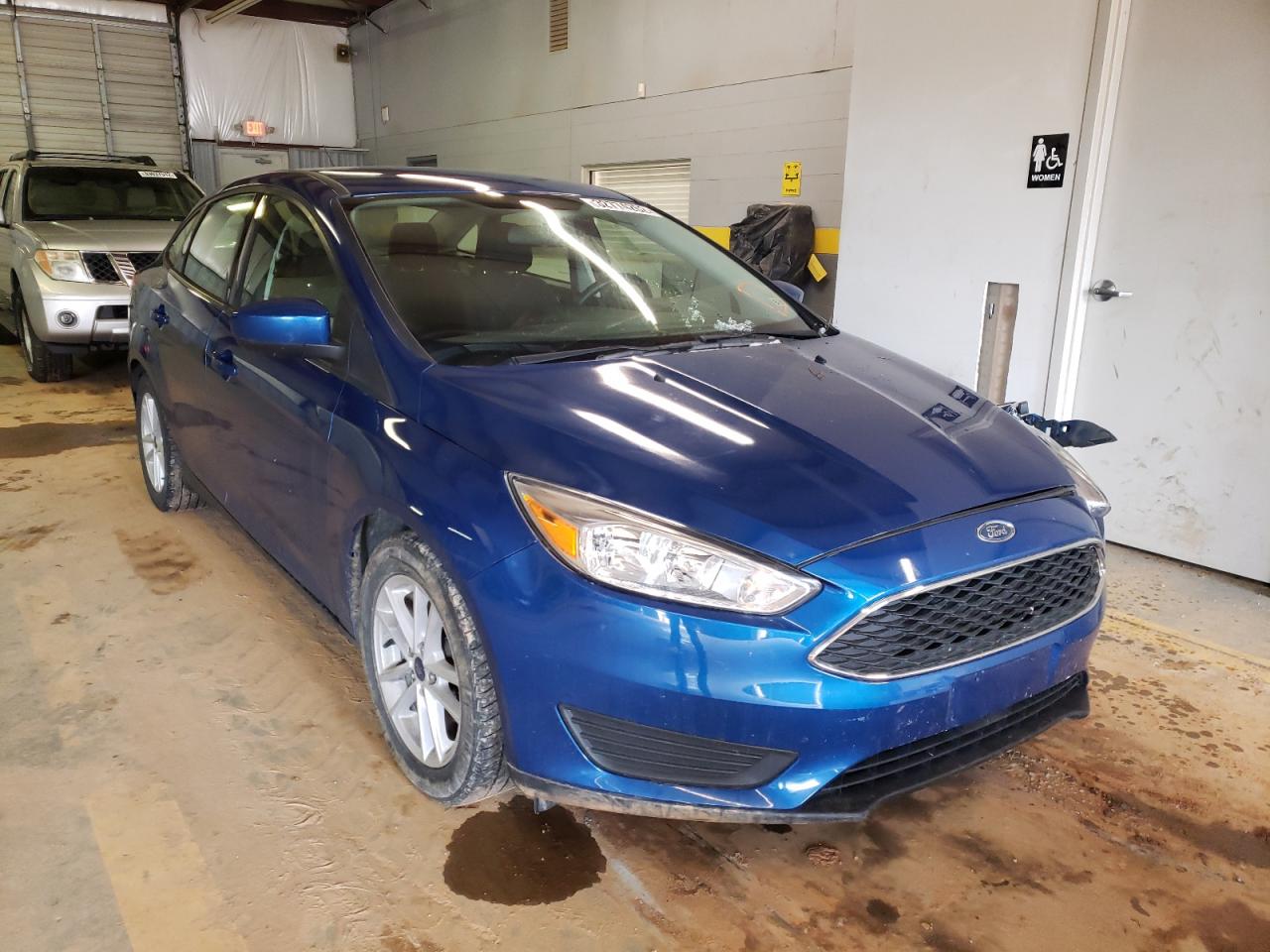 FORD FOCUS SE 2018 with VIN 1FADP3F26JL212611 - Photo from auction