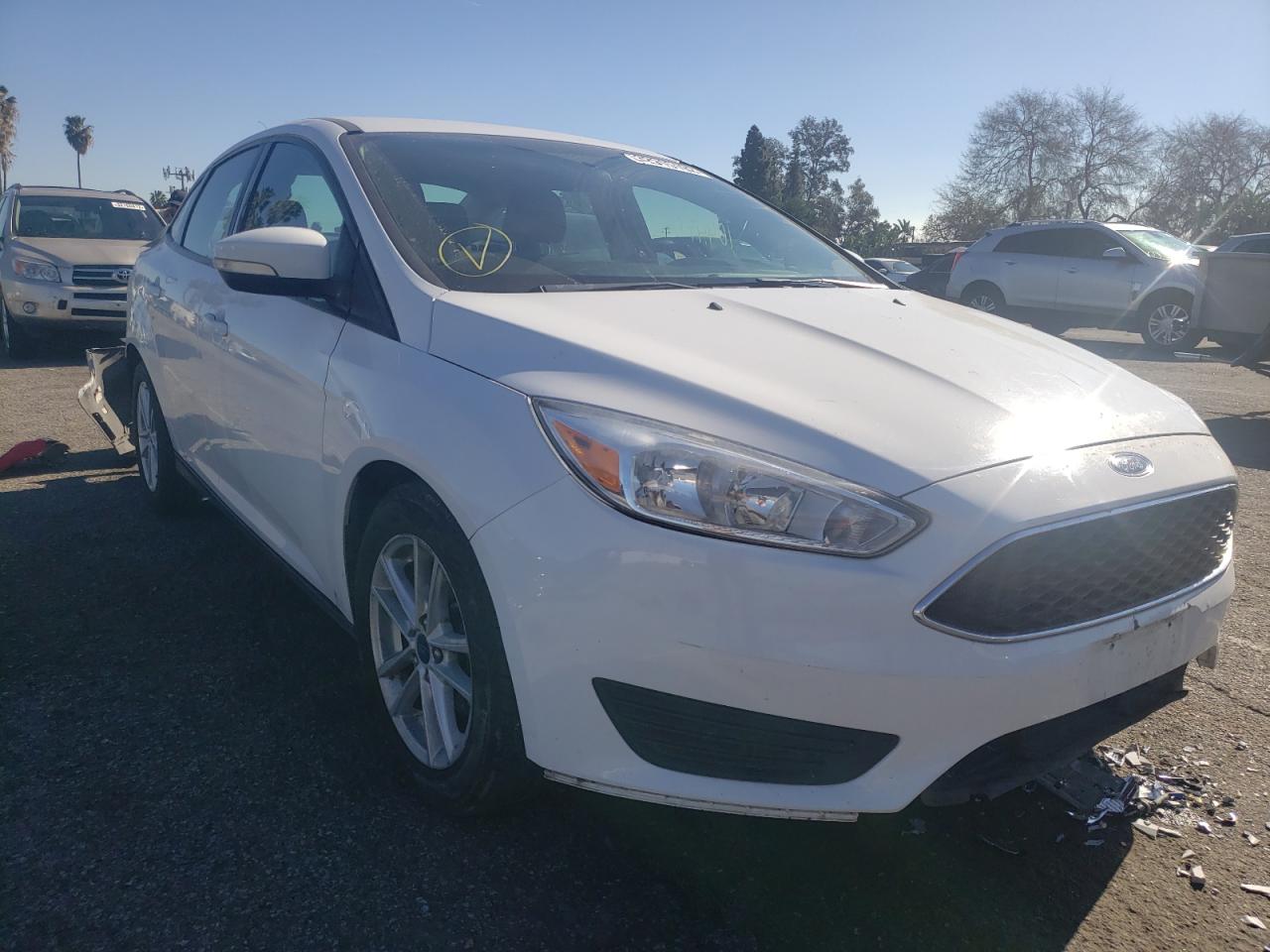 FORD FOCUS SE 2017 with VIN 1FADP3F27HL308869 - Photo from auction