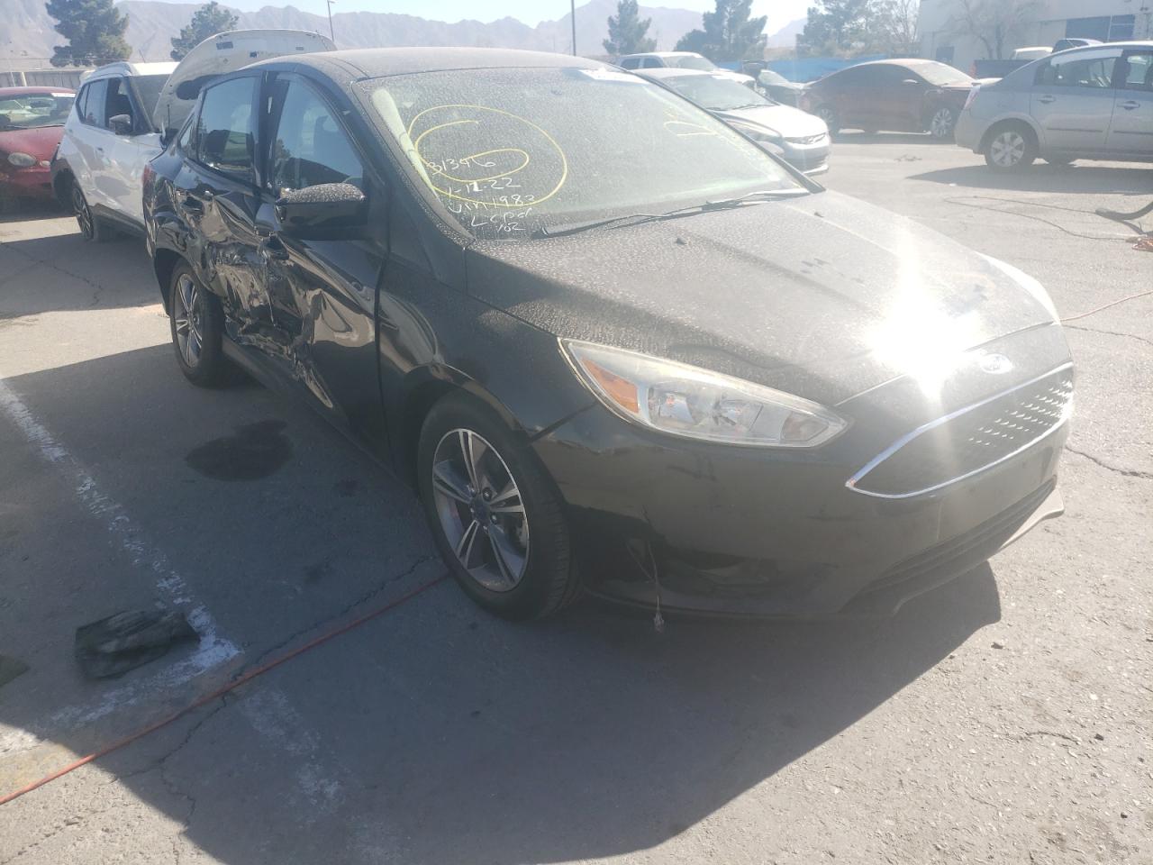 FORD FOCUS SE 2018 with VIN 1FADP3FE5JL259283 - Photo from auction