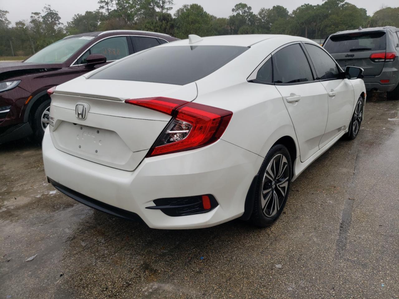 Photo 4 from auction – 2016 HONDA CIVIC EXL with VIN 19XFC1F73GE034107