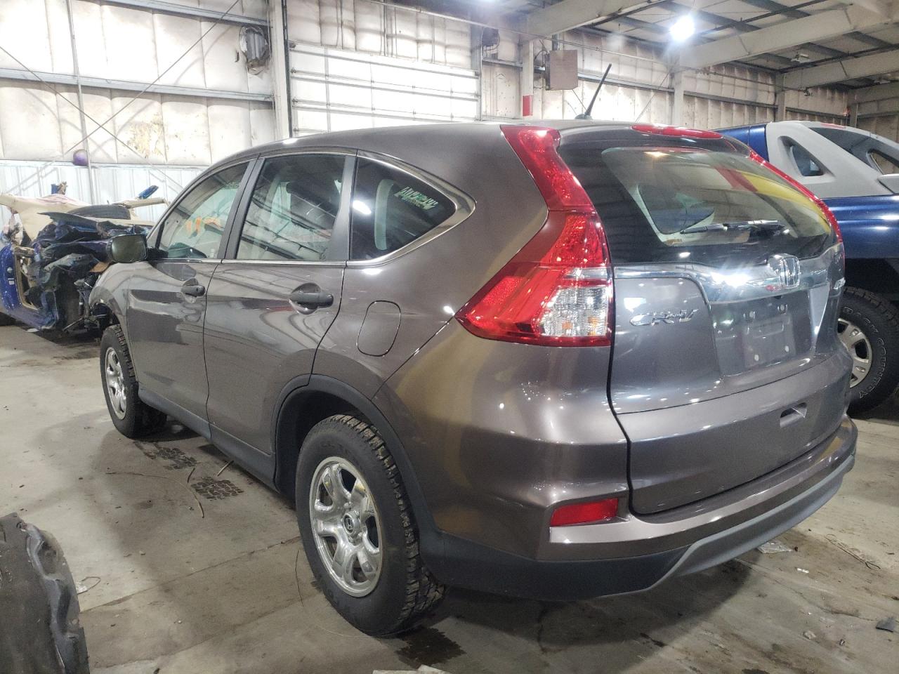 Photo 3 from auction – 2015 HONDA CR-V LX with VIN 2HKRM4H31FH650792