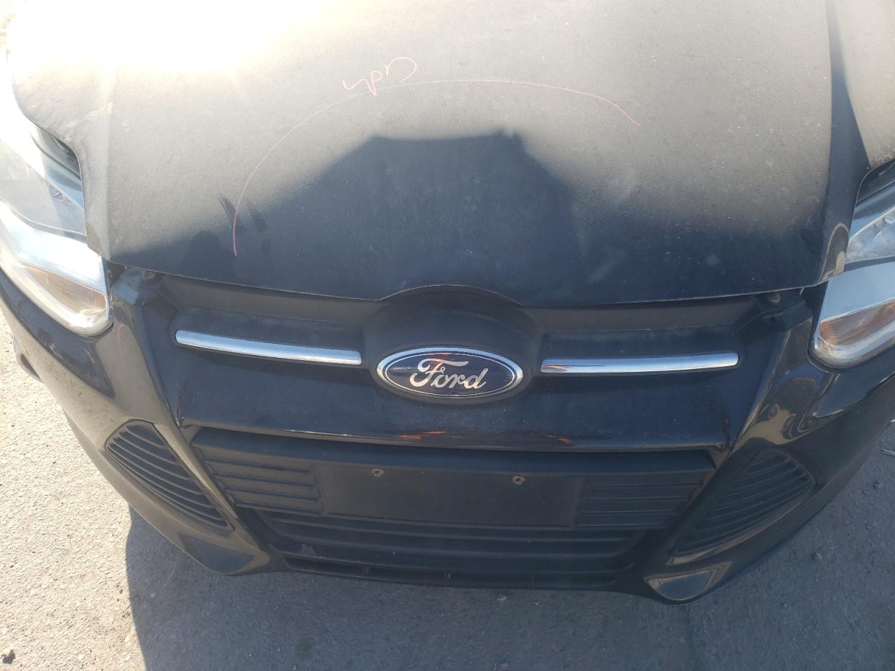 Foto 9 de la subasta – 2014 FORD FOCUS SE con VIN 1FADP3F24EL108902
