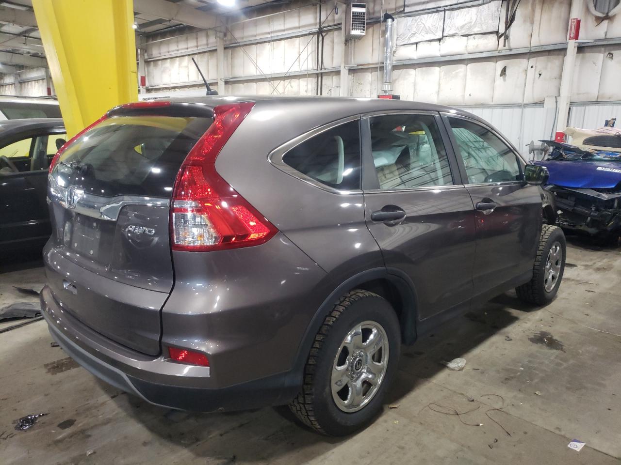 Photo 4 from auction – 2015 HONDA CR-V LX with VIN 2HKRM4H31FH650792