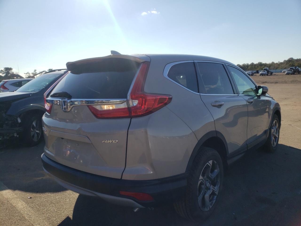 Photo 4 from auction – 2017 HONDA CR-V EXL with VIN 5J6RW2H80HL009183
