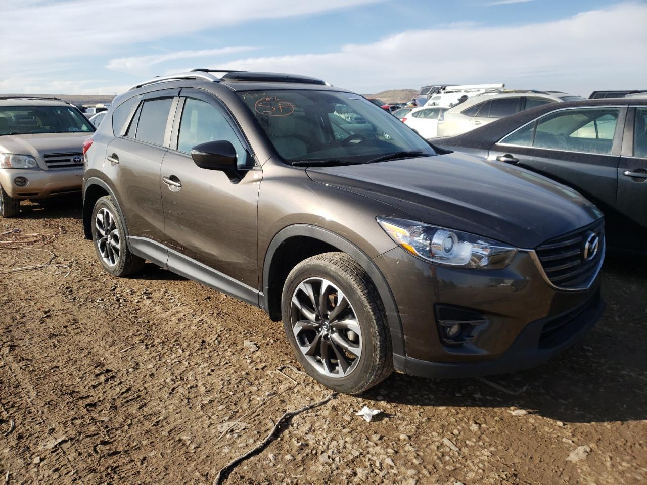 MAZDA CX-5 GT 2016 with VIN JM3KE4DY6G0853859 - Photo from auction