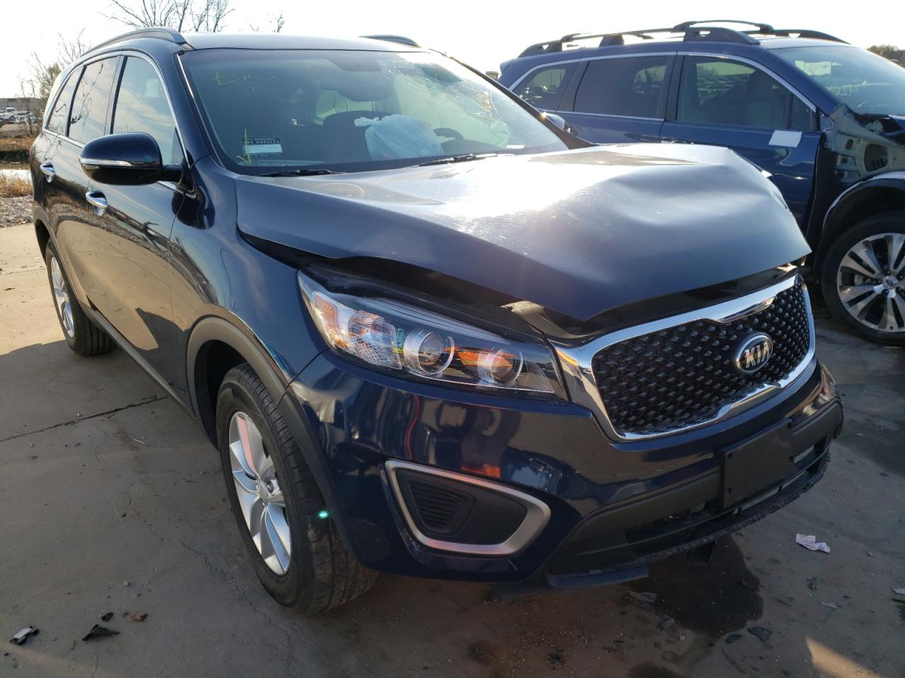 KIA SORENTO LX 2016 with VIN 5XYPG4A32GG118565 - Photo from auction