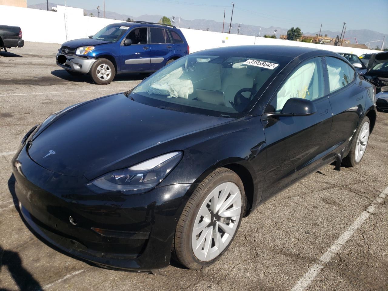 Photo 2 from auction – 2021 TESLA MODEL 3 with VIN 5YJ3E1EA9MF994337