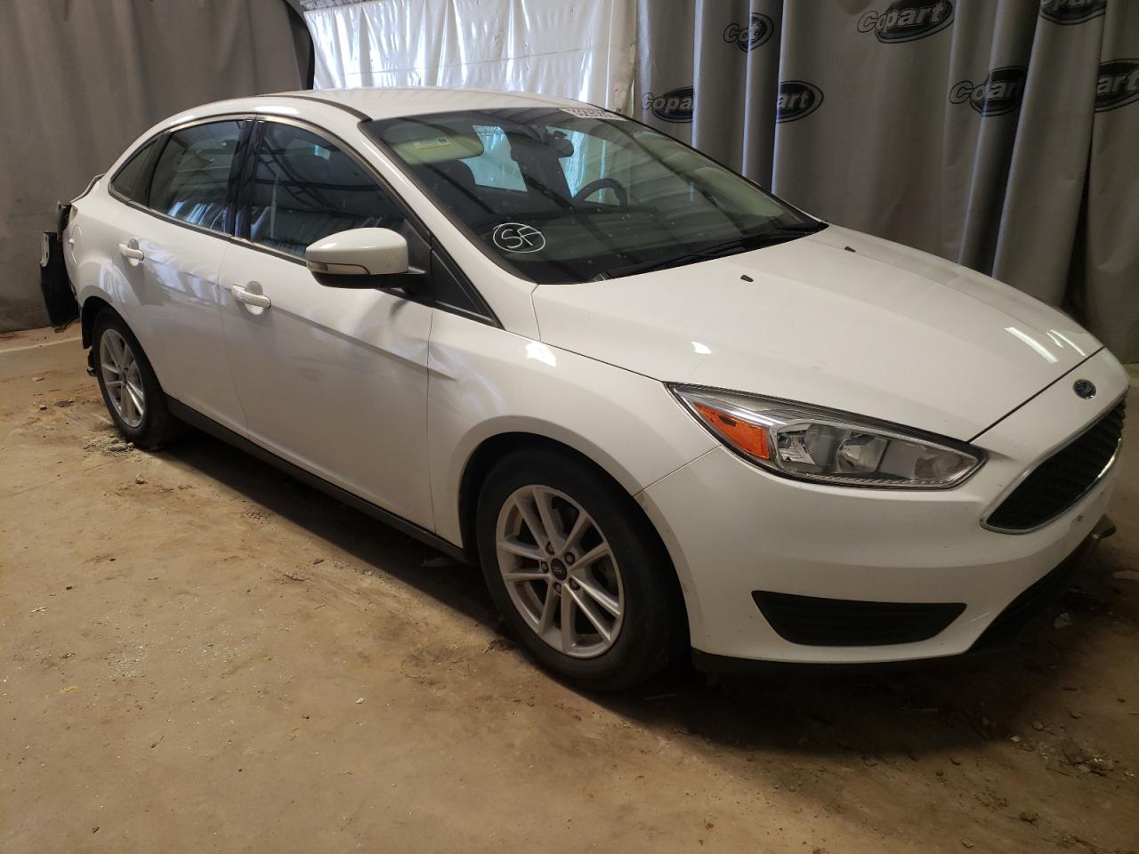 FORD FOCUS SE 2017 with VIN 1FADP3F21HL313288 - Photo from auction