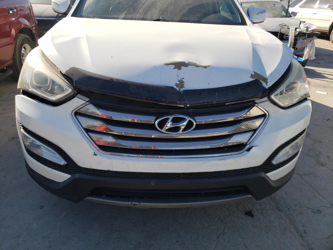Photo 7 from auction – 2013 HYUNDAI SANTA FE S with VIN 5XYZU3LA9DG068024