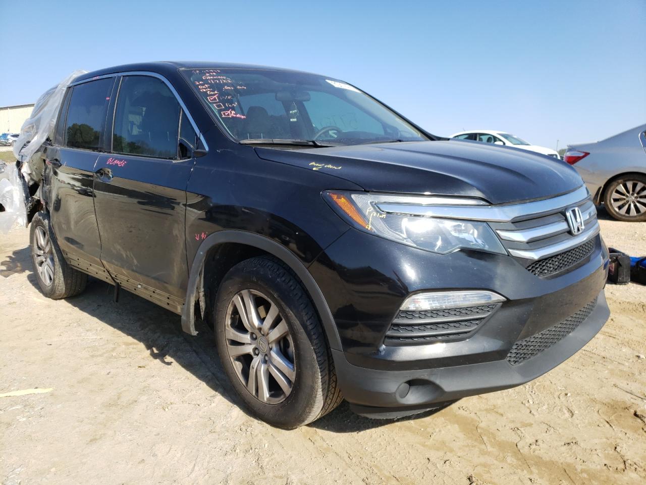 HONDA PILOT LX 2018 with VIN 5FNYF5H18JB032709 - Photo from auction