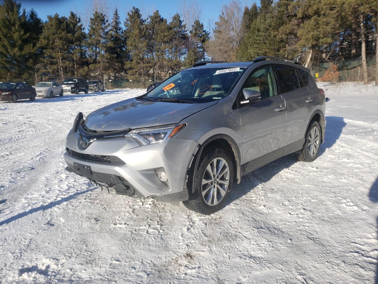 Photo 2 from auction – 2018 TOYOTA RAV4 LIMIT with VIN 2T3DFREV2JW725721