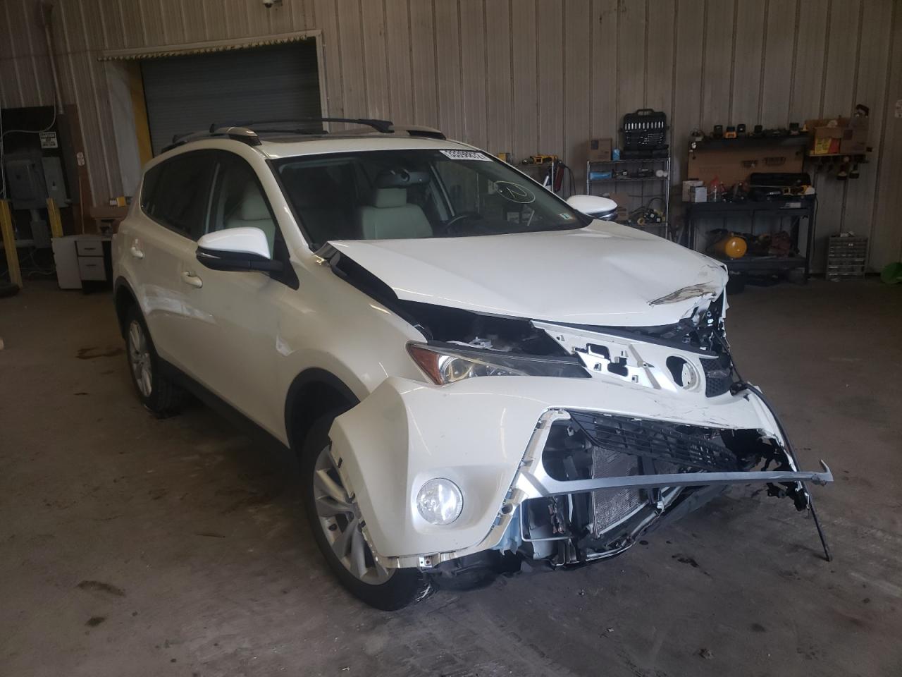 TOYOTA RAV4 LIMIT 2014 with VIN JTMDFREV1ED071393 - Photo from auction