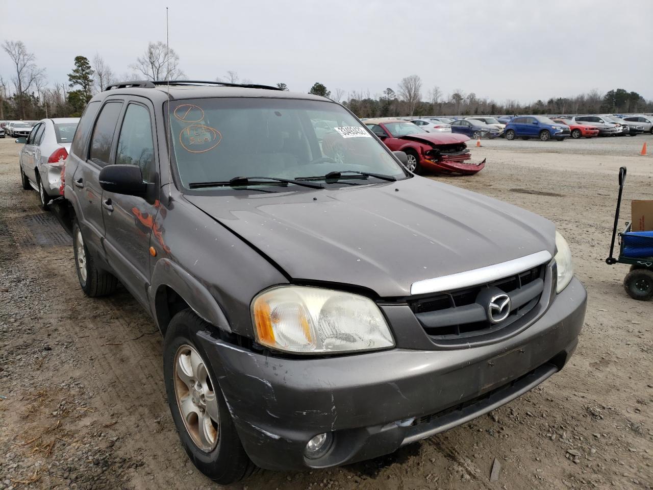 MAZDA TRIBUTE LX 2003 with VIN 4F2CZ94103KM14060 - Photo from auction