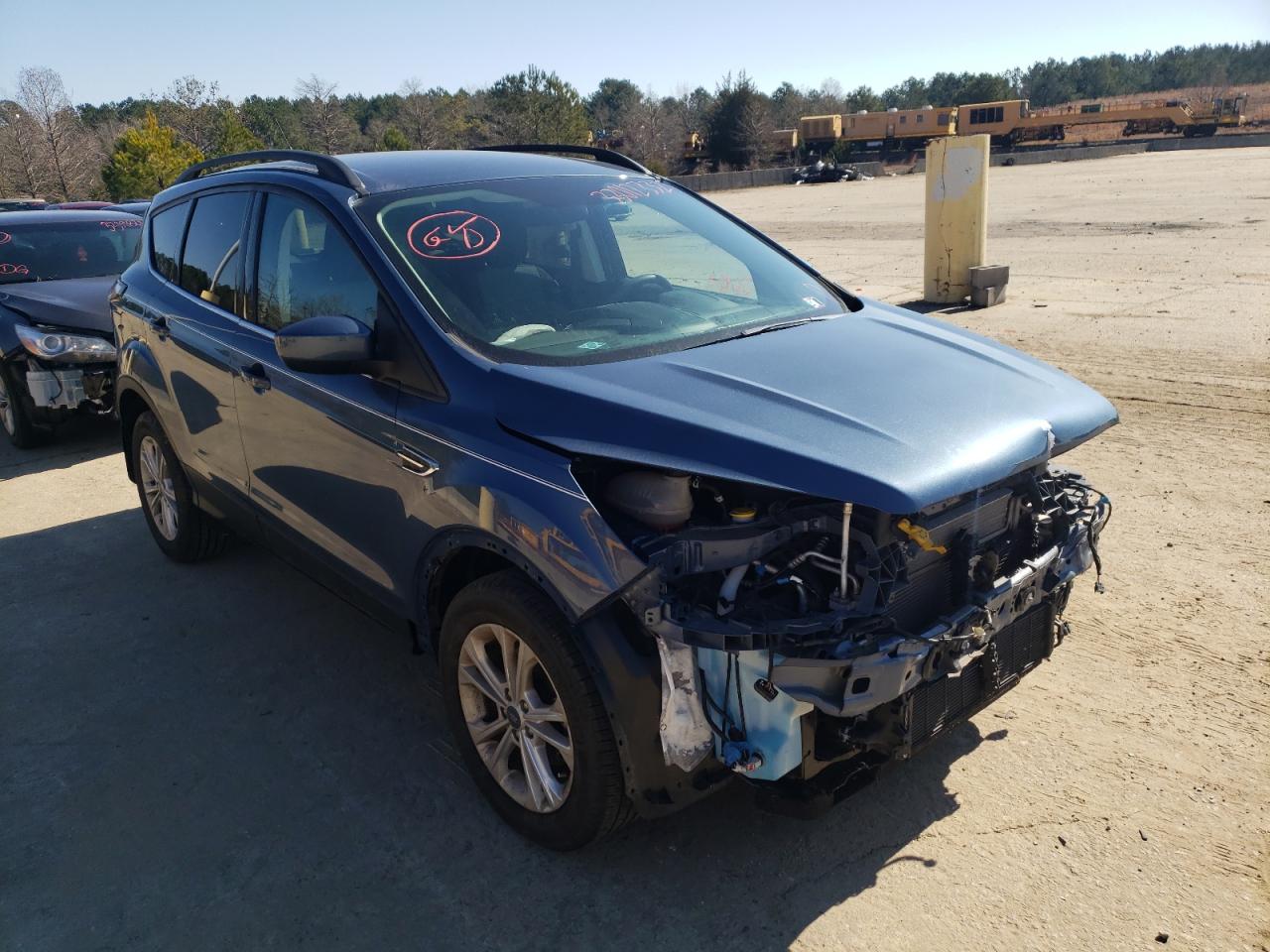 FORD ESCAPE SE 2018 with VIN 1FMCU0GD9JUC00648 - Photo from auction