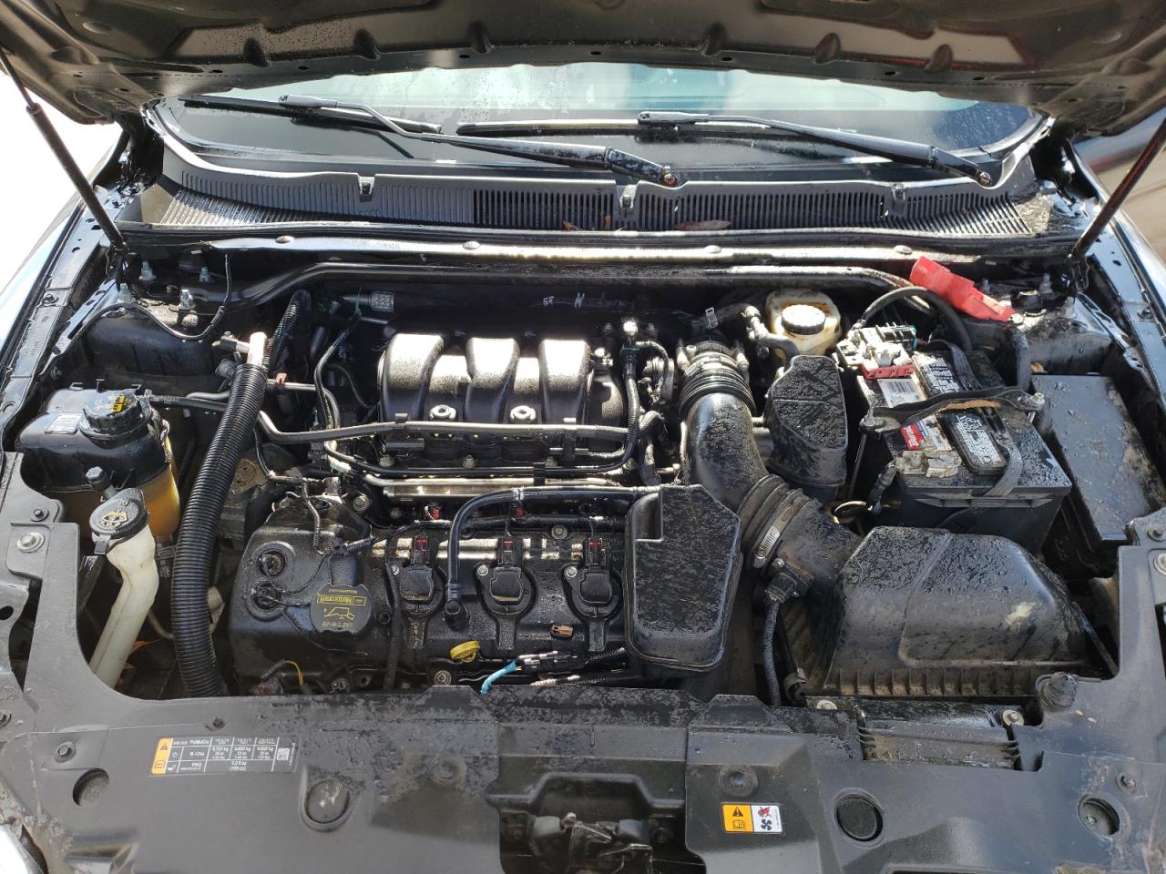 Photo 7 from auction – 2013 FORD TAURUS SEL with VIN 1FAHP2H82DG230677