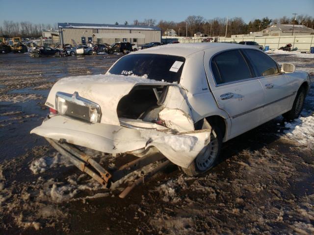 Photo 4 from auction – 1999 LINCOLN TOWN CAR E with VIN 1LNHM81W2XY667863