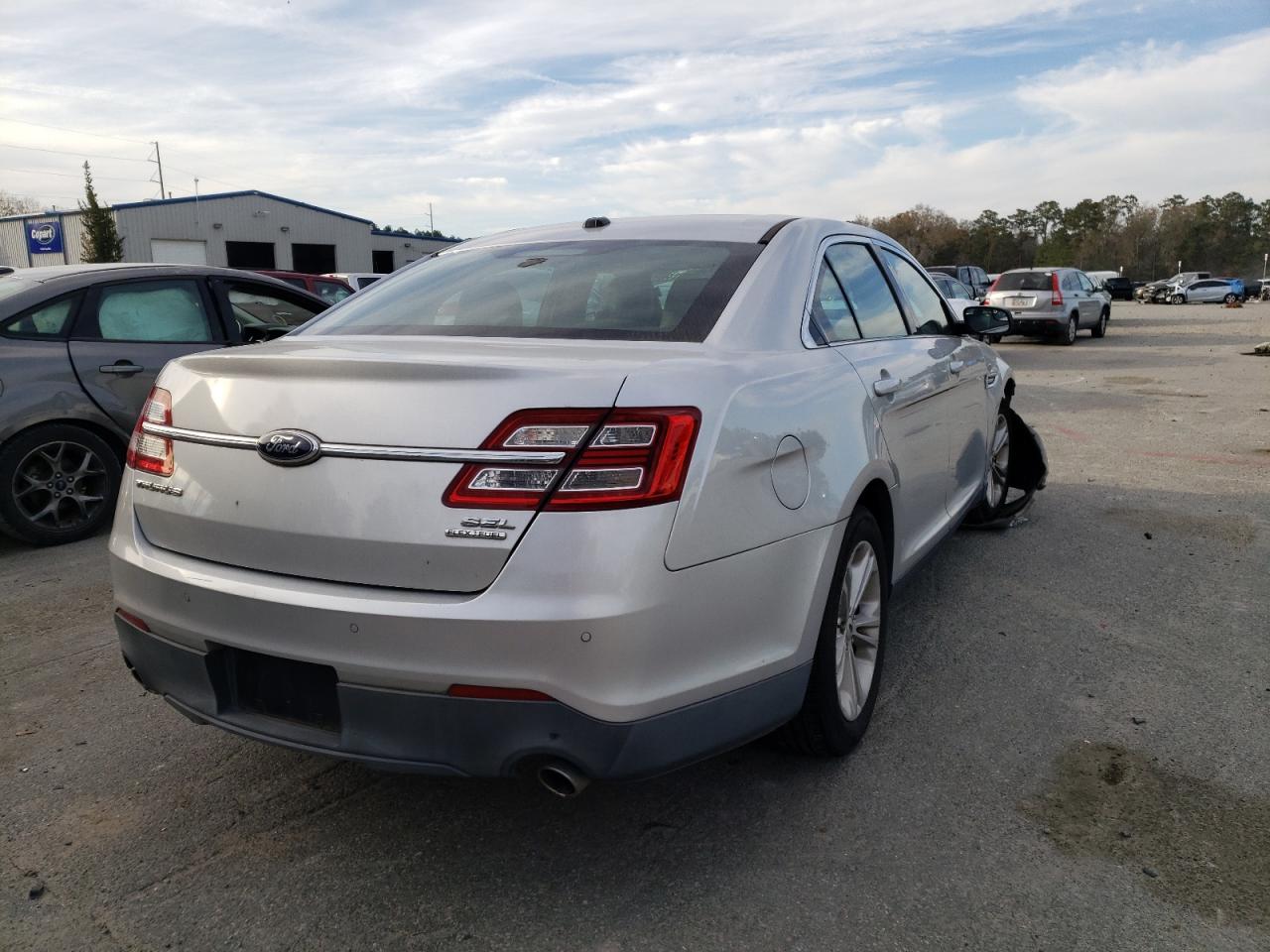 Photo 4 from auction – 2013 FORD TAURUS SEL with VIN 1FAHP2E80DG201604