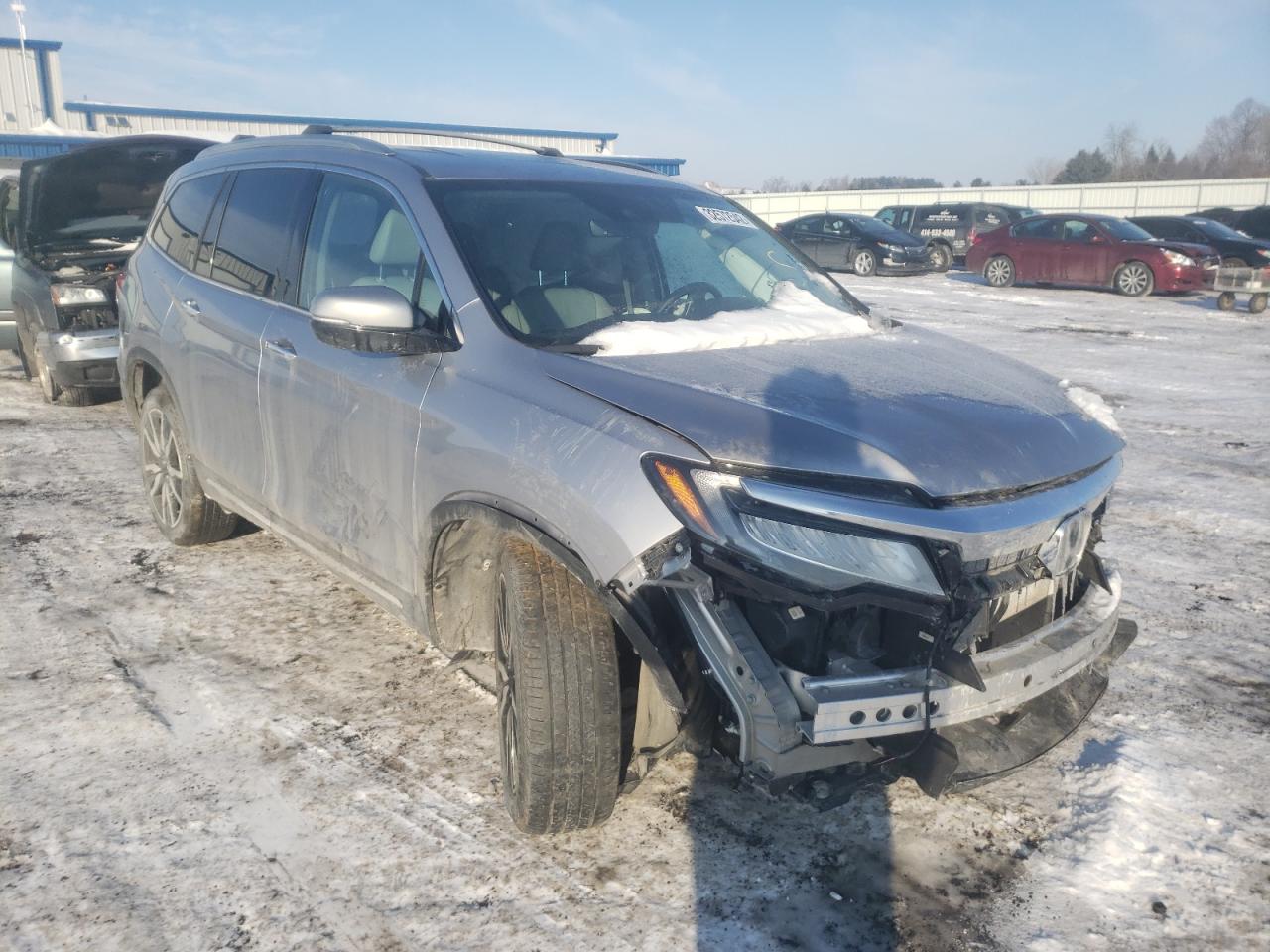 HONDA PILOT TOUR 2019 with VIN 5FNYF6H69KB001911 - Photo from auction