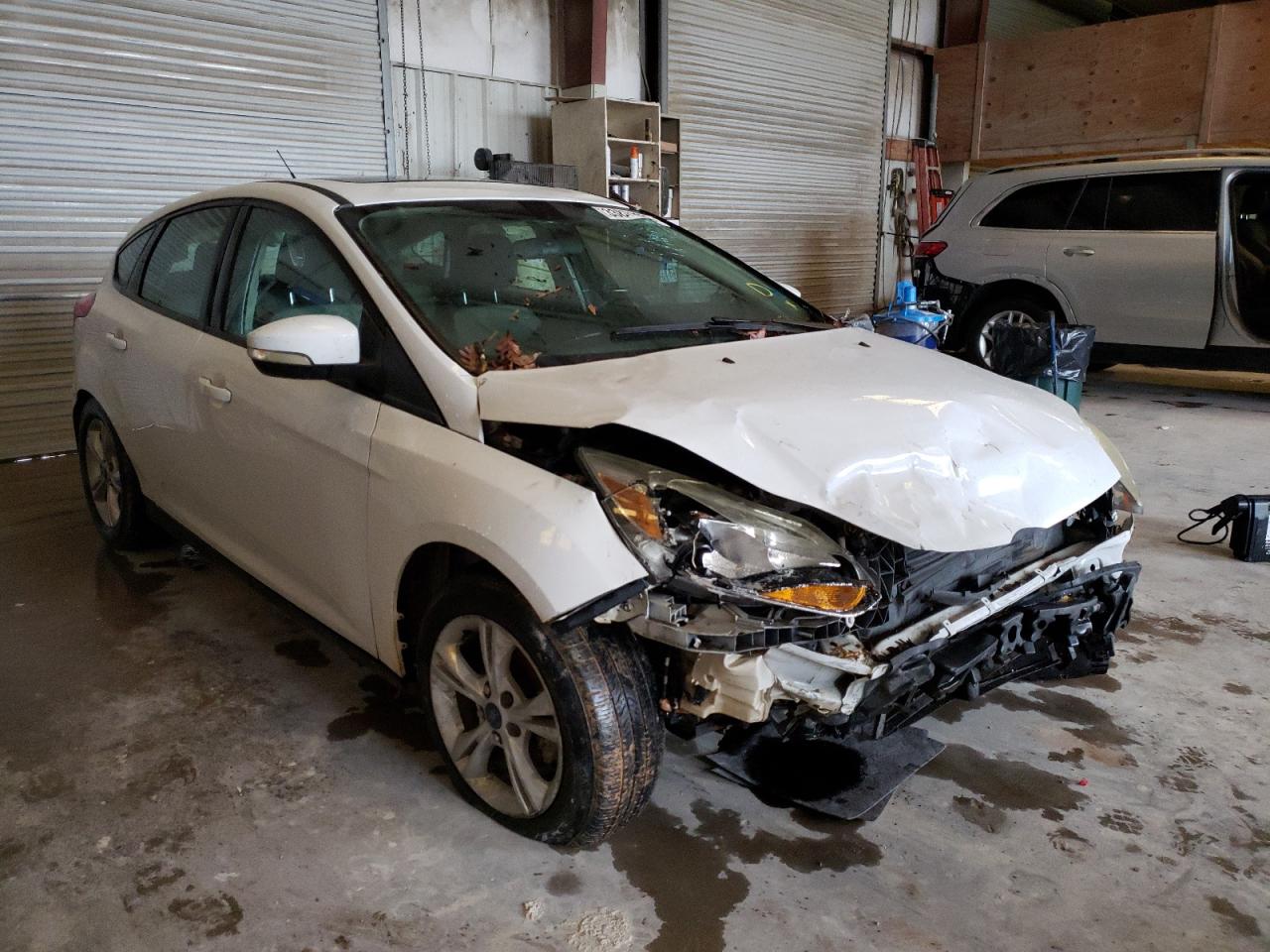 FORD FOCUS SE 2014 with VIN 1FADP3K22EL170742 - Photo from auction