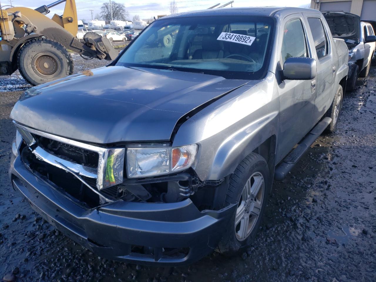 Photo 2 from auction – 2010 HONDA RIDGELINE with VIN 5FPYK1F50AB002735