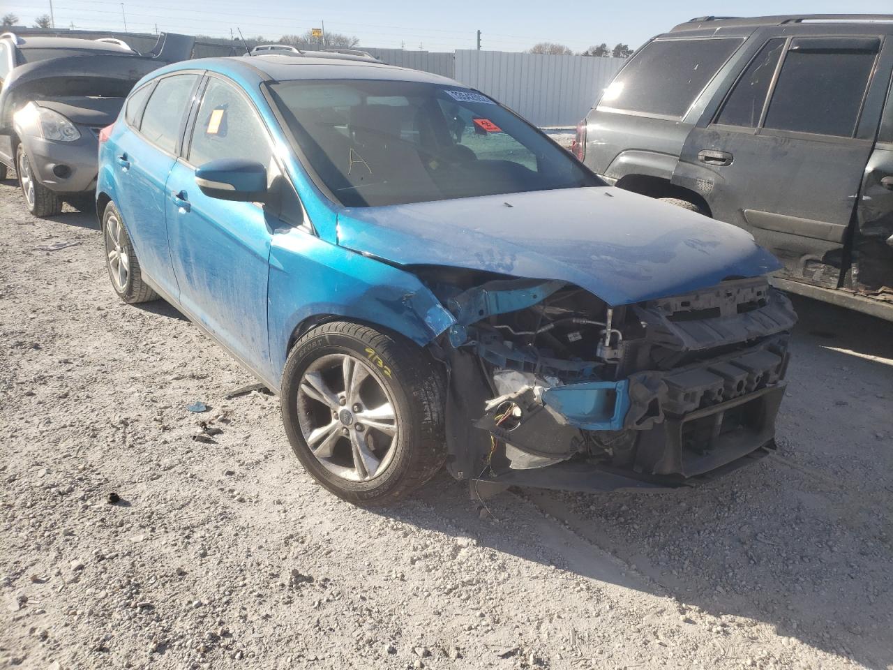FORD FOCUS SE 2014 with VIN 1FADP3K21EL277877 - Photo from auction