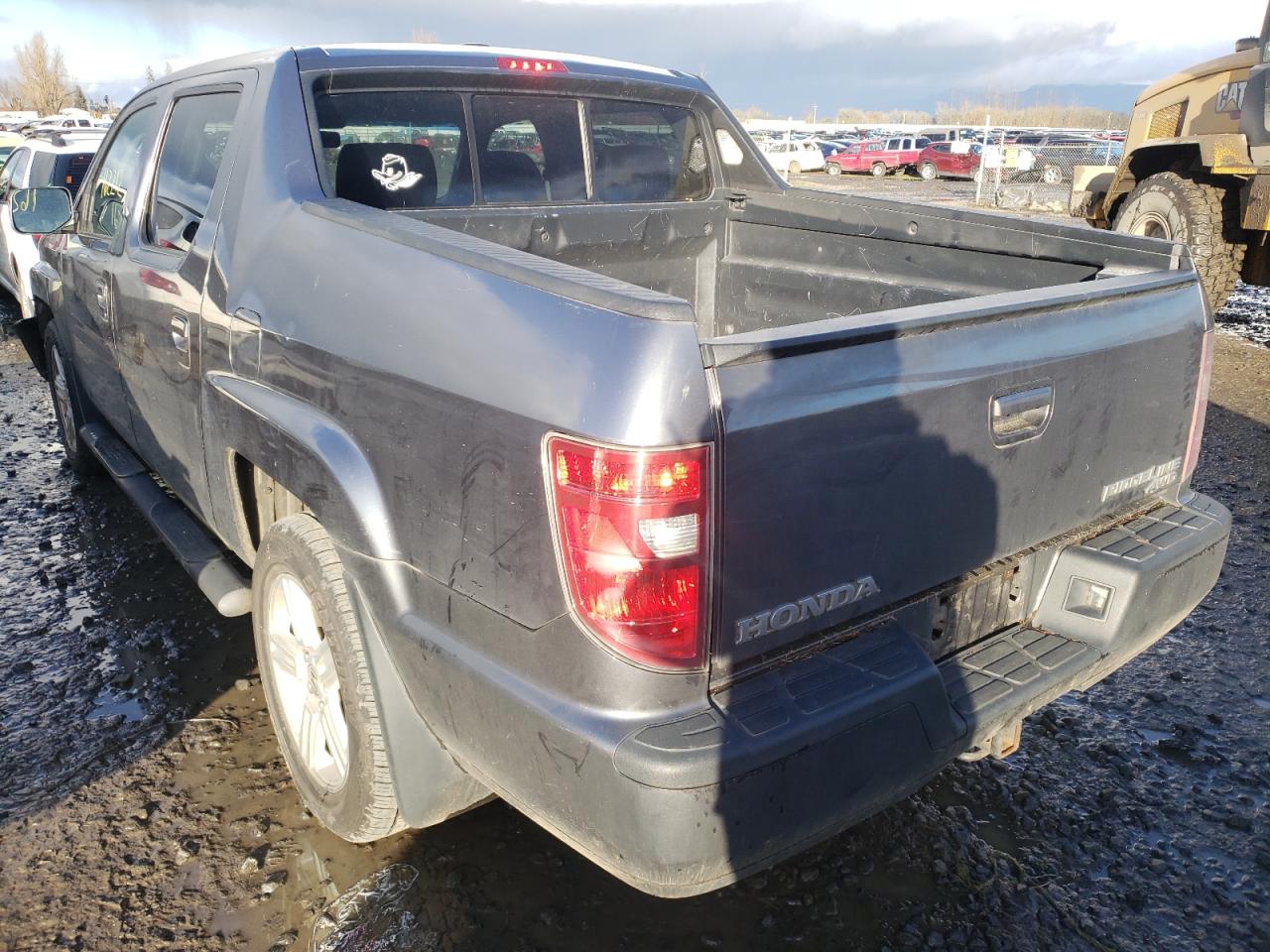 Photo 3 from auction – 2010 HONDA RIDGELINE with VIN 5FPYK1F50AB002735
