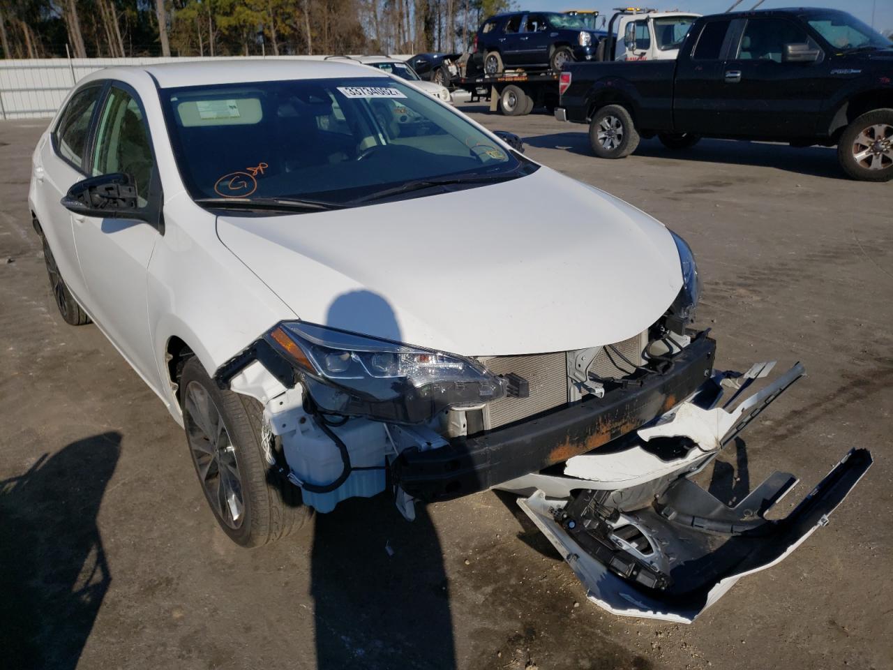 TOYOTA COROLLA L 2019 with VIN 5YFBURHE7KP927457 - Photo from auction