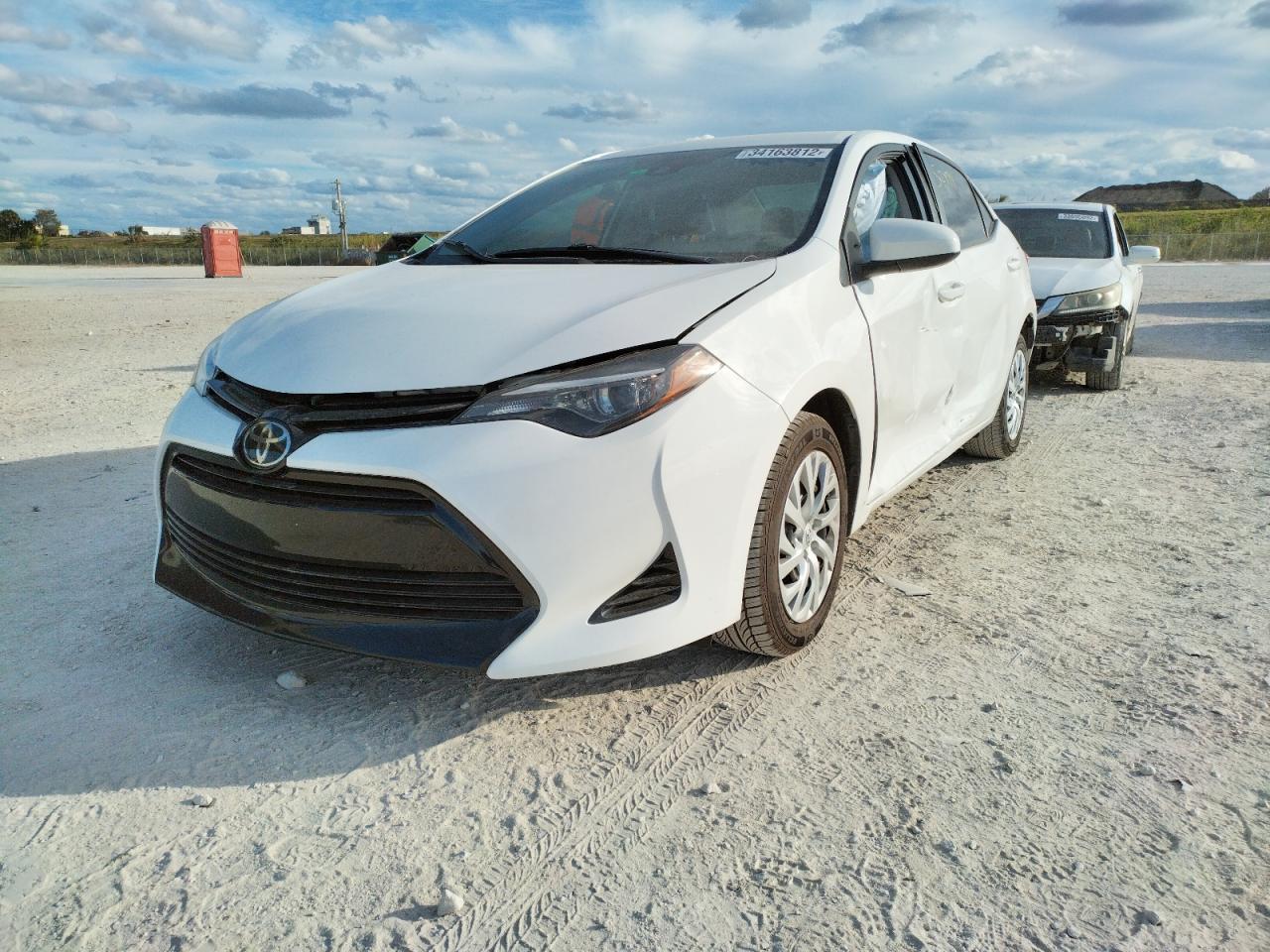 Photo 2 from auction – 2018 TOYOTA COROLLA L with VIN 5YFBURHE0JP850011