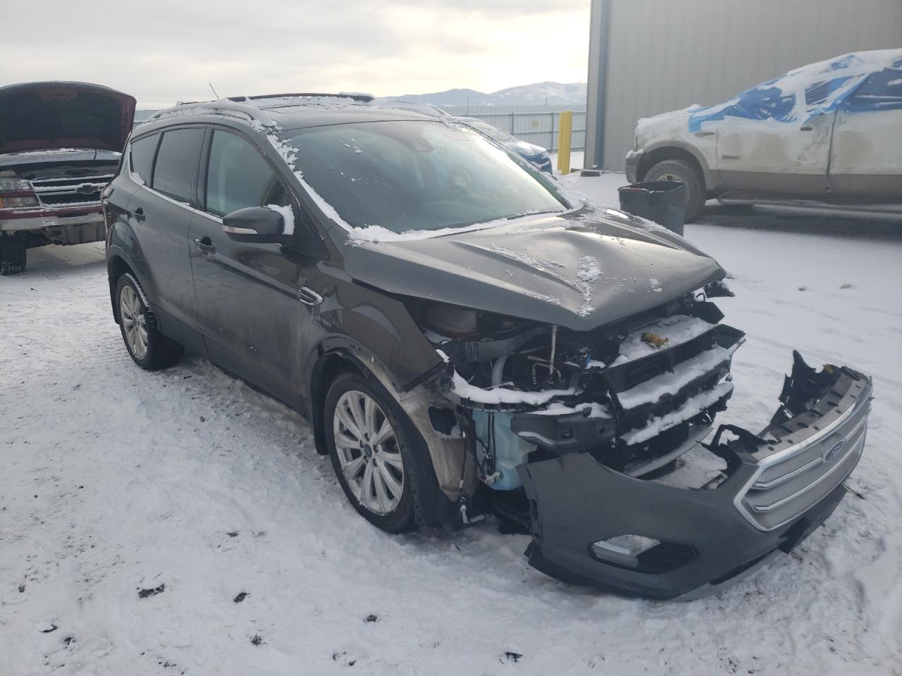 FORD ESCAPE TIT 2017 with VIN 1FMCU9J98HUC96288 - Photo from auction