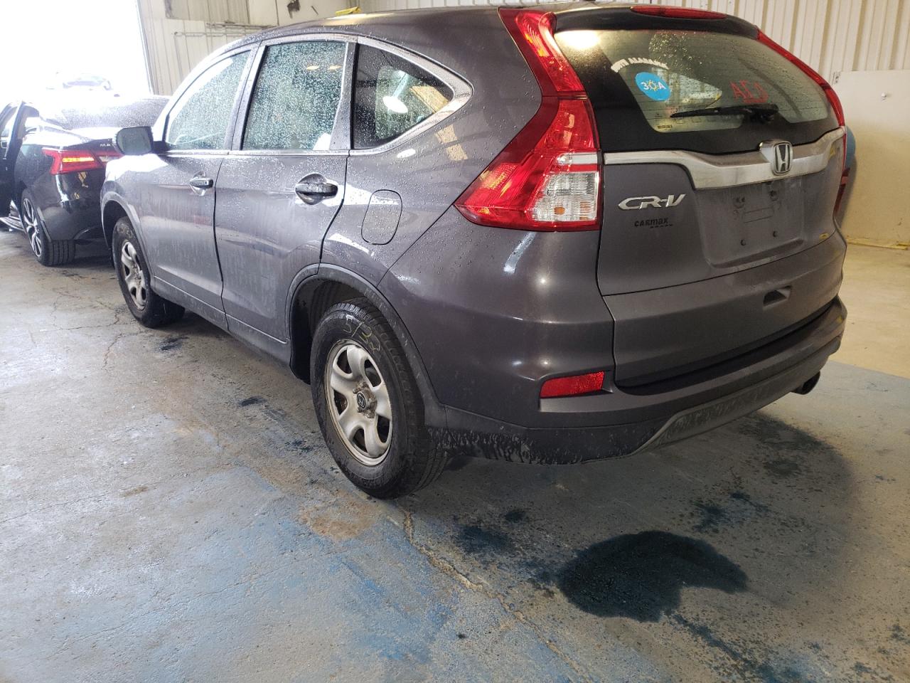 Photo 3 from auction – 2015 HONDA CR-V LX with VIN 2HKRM3H39FH502352