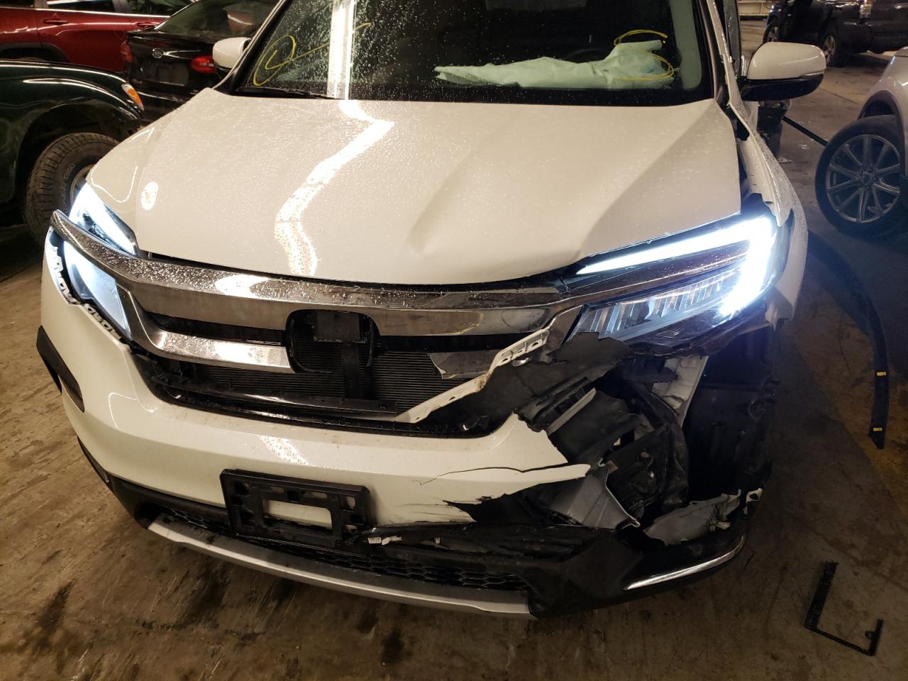 Photo 9 from auction – 2019 HONDA PILOT TOUR with VIN 5FNYF6H67KB012552