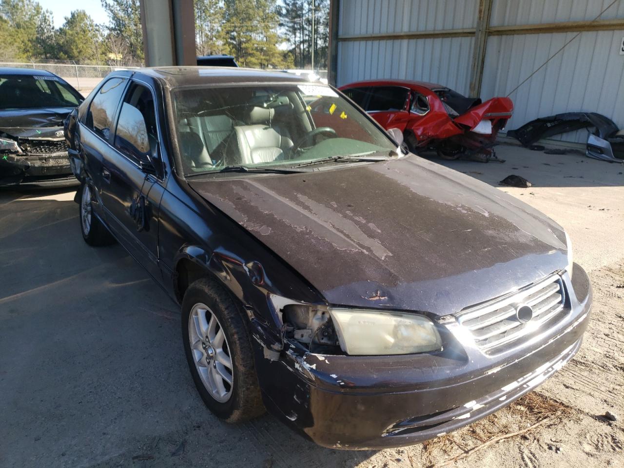 TOYOTA CAMRY LE 2000 with VIN 4T1BF28K5YU104976 - Photo from auction