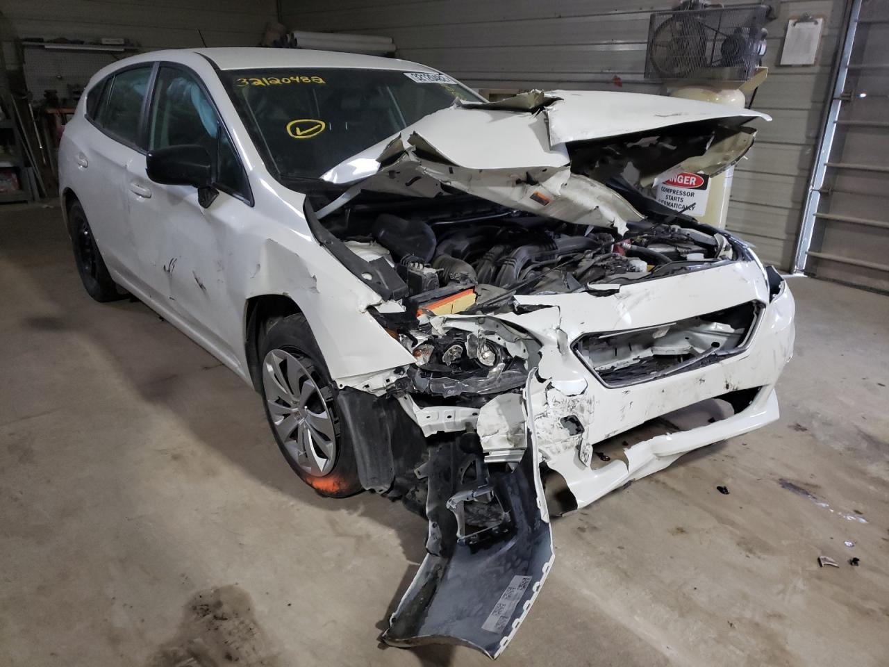 SUBARU IMPREZA 2019 with VIN 4S3GTAA63K3733711 - Photo from auction