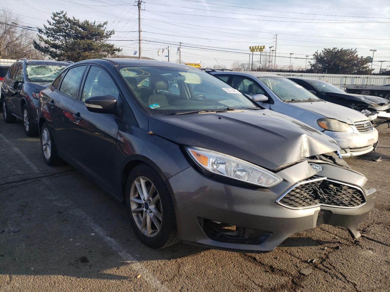 FORD FOCUS SE 2015 with VIN 1FADP3F23FL288276 - Photo from auction