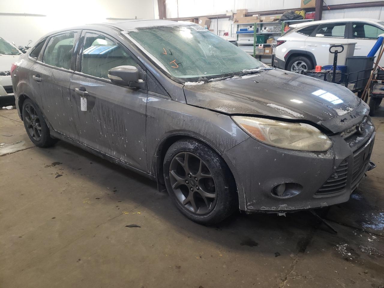 FORD FOCUS SE 2013 with VIN 1FADP3F24DL377433 - Photo from auction