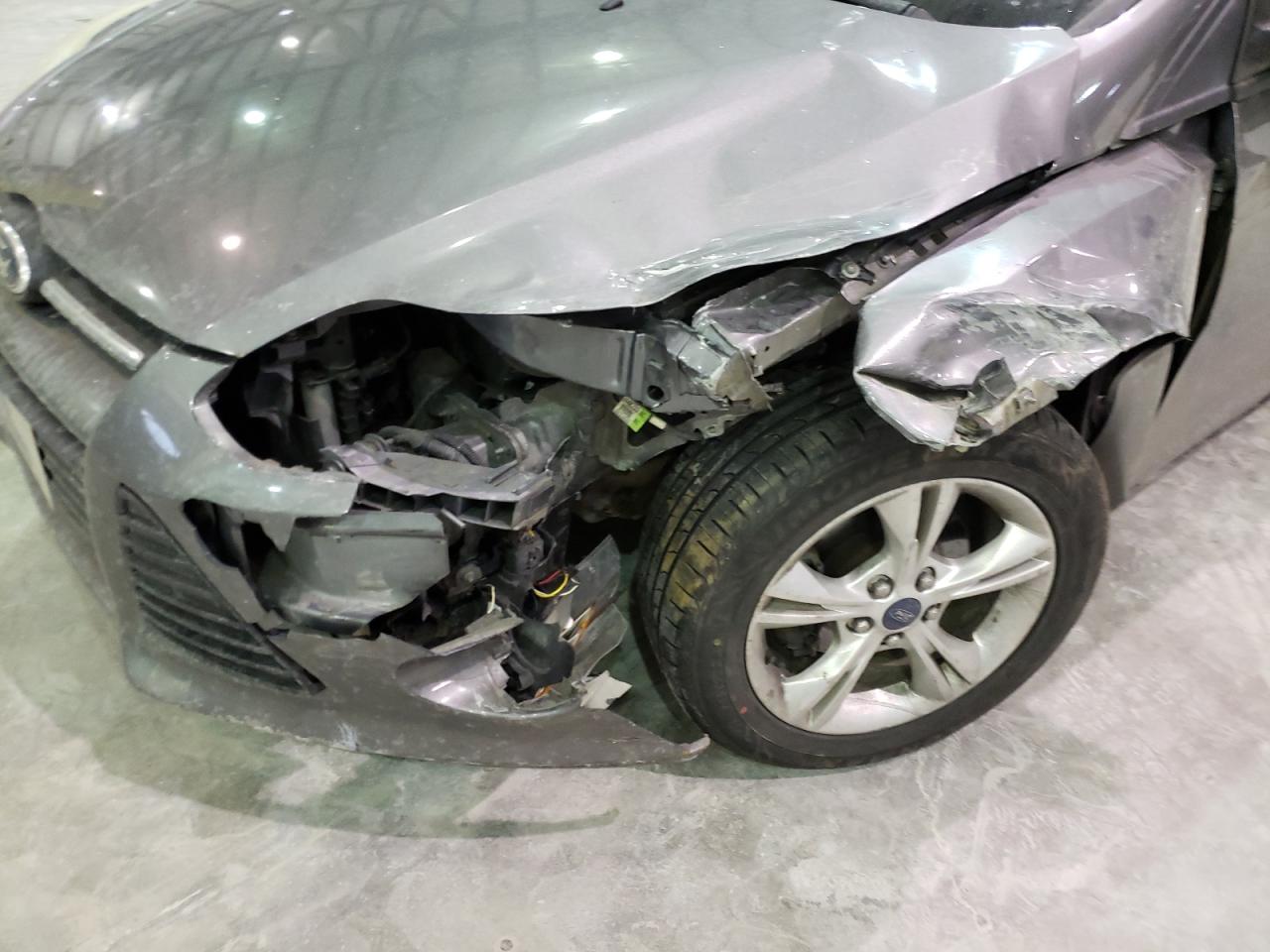 Foto 9 de la subasta – 2014 FORD FOCUS SE con VIN 1FADP3F21EL193536