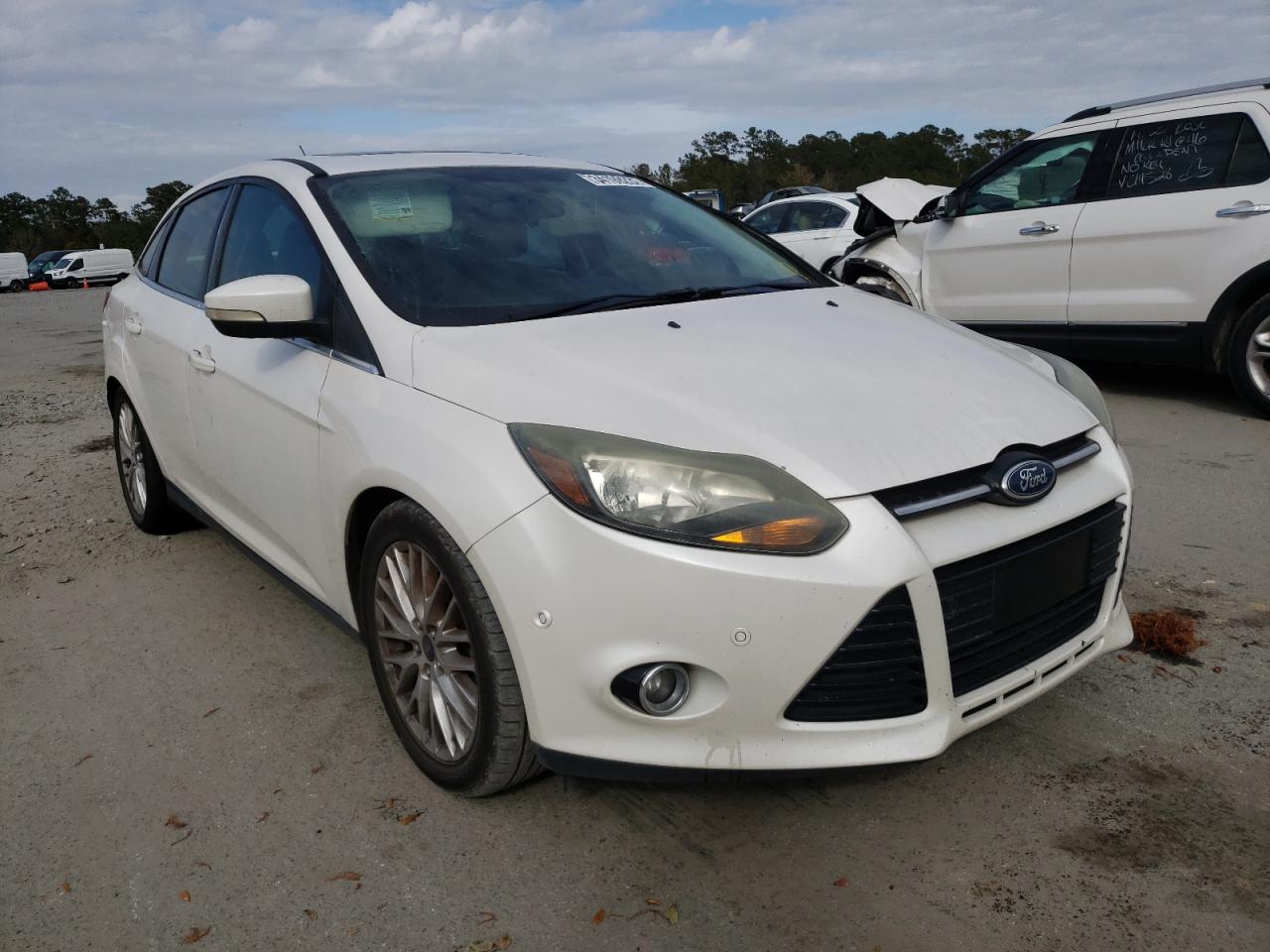 FORD FOCUS TITA 2014 with VIN 1FADP3J25EL417219 - Photo from auction