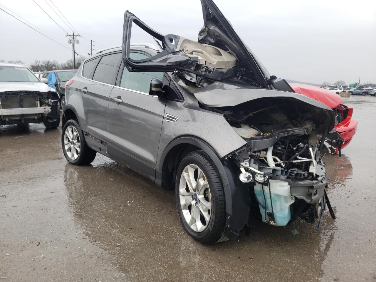 FORD ESCAPE TIT 2014 with VIN 1FMCU0JX9EUA86479 - Photo from auction