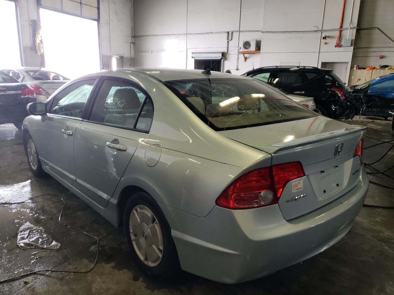 Photo 3 from auction – 2006 HONDA CIVIC HYBR with VIN JHMFA36236S017890