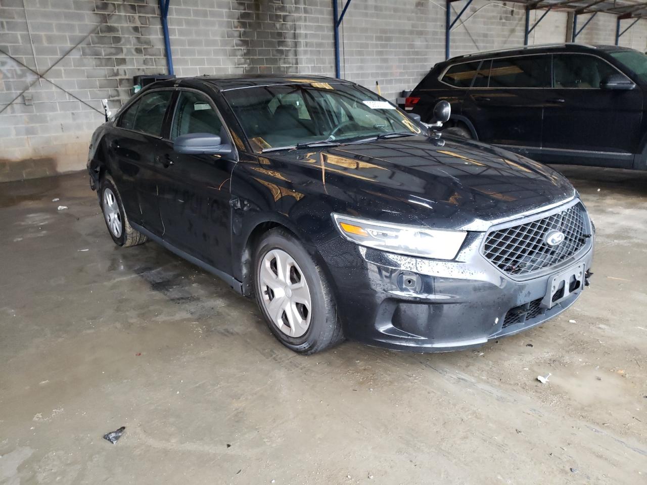FORD TAURUS POL 2015 with VIN 1FAHP2MK2FG183266 - Photo from auction