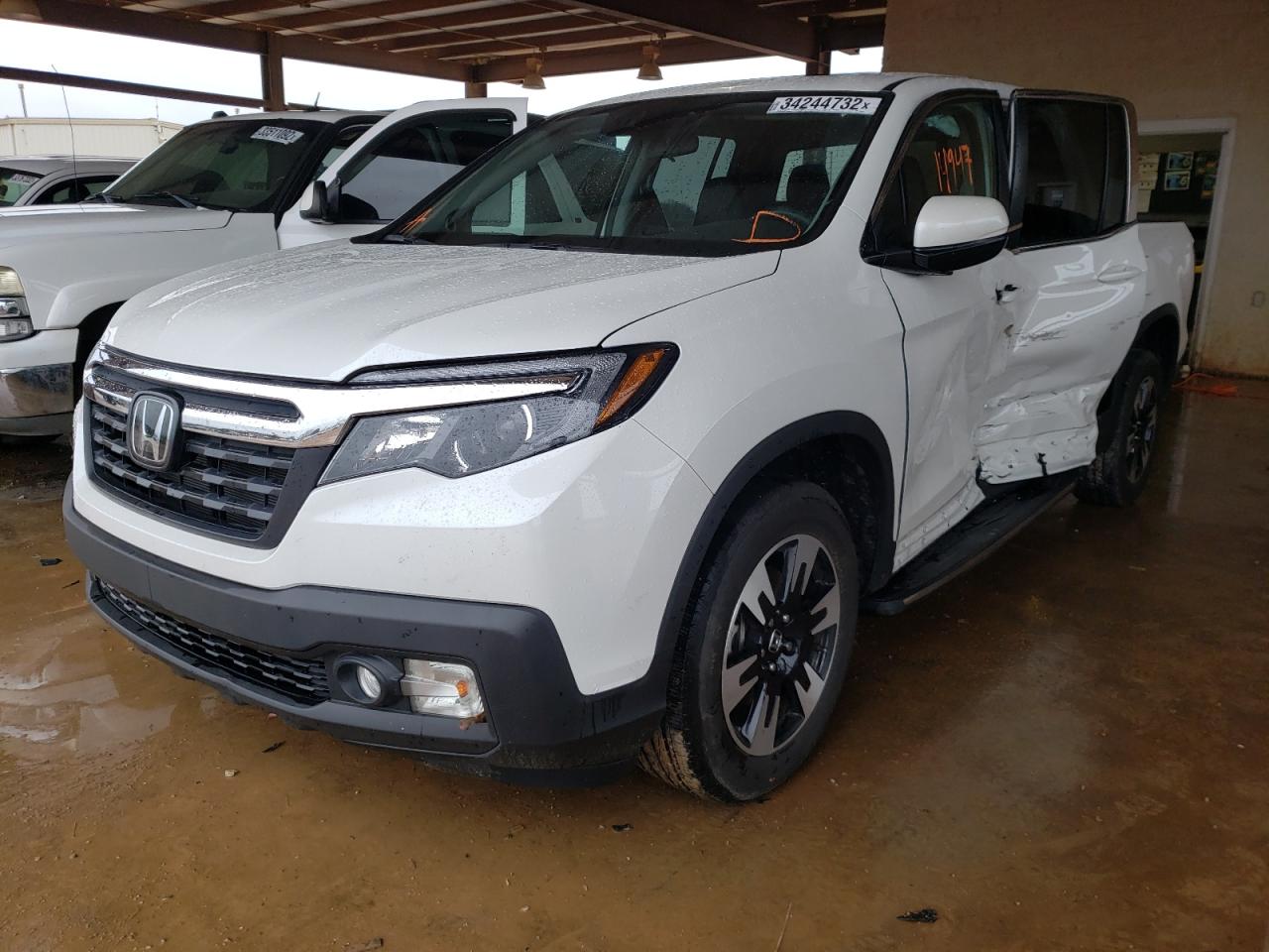 Photo 2 from auction – 2020 HONDA RIDGELINE with VIN 5FPYK3F52LB030406