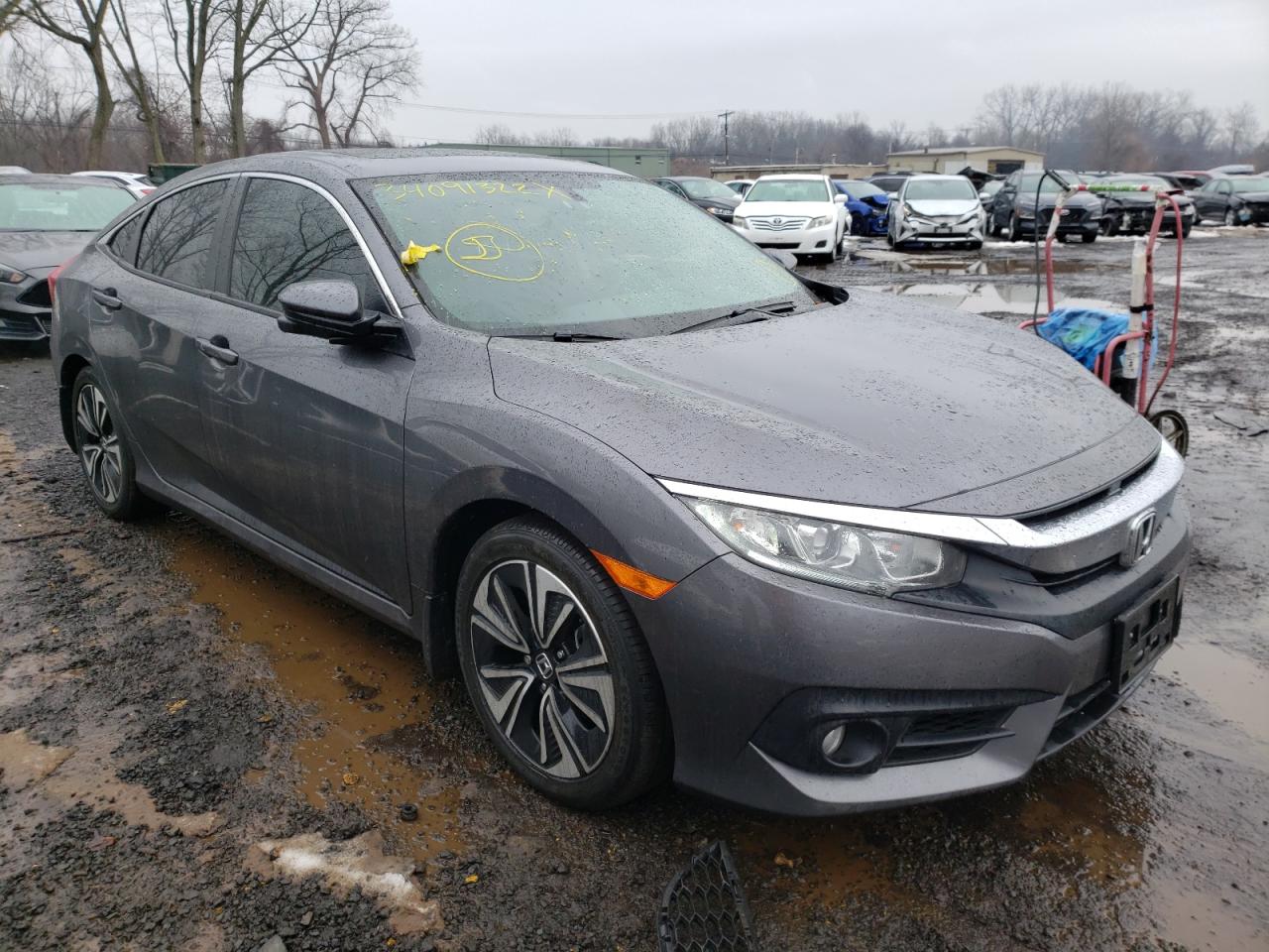 HONDA CIVIC EXL 2018 with VIN JHMFC1F71JX022124 - Photo from auction