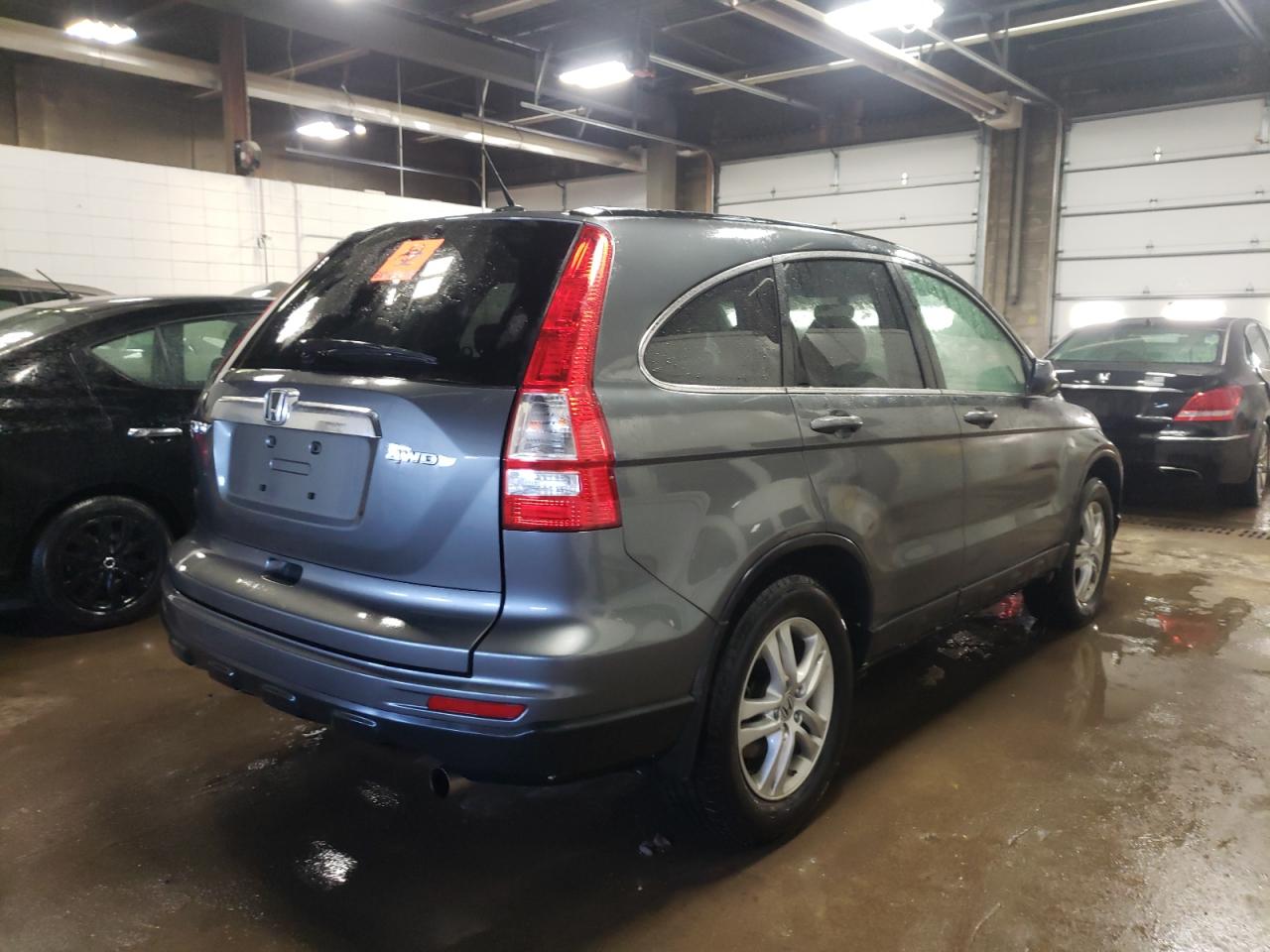 Photo 4 from auction – 2011 HONDA CR-V with VIN JHLRE4H70BC003101
