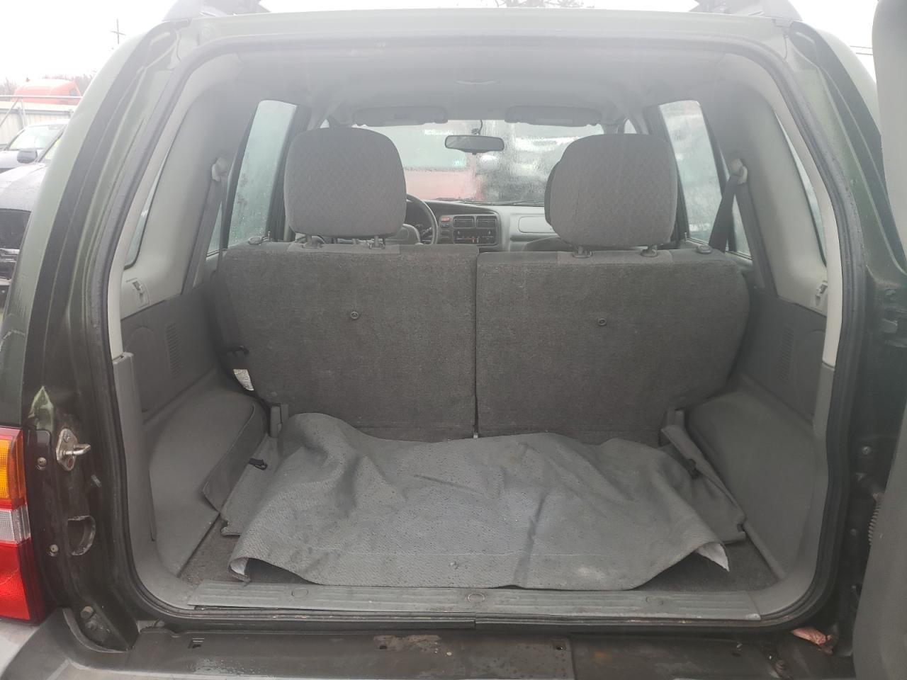 Photo 9 from auction – 2000 CHEVROLET TRACKER with VIN 2CNBJ13C0Y6922736