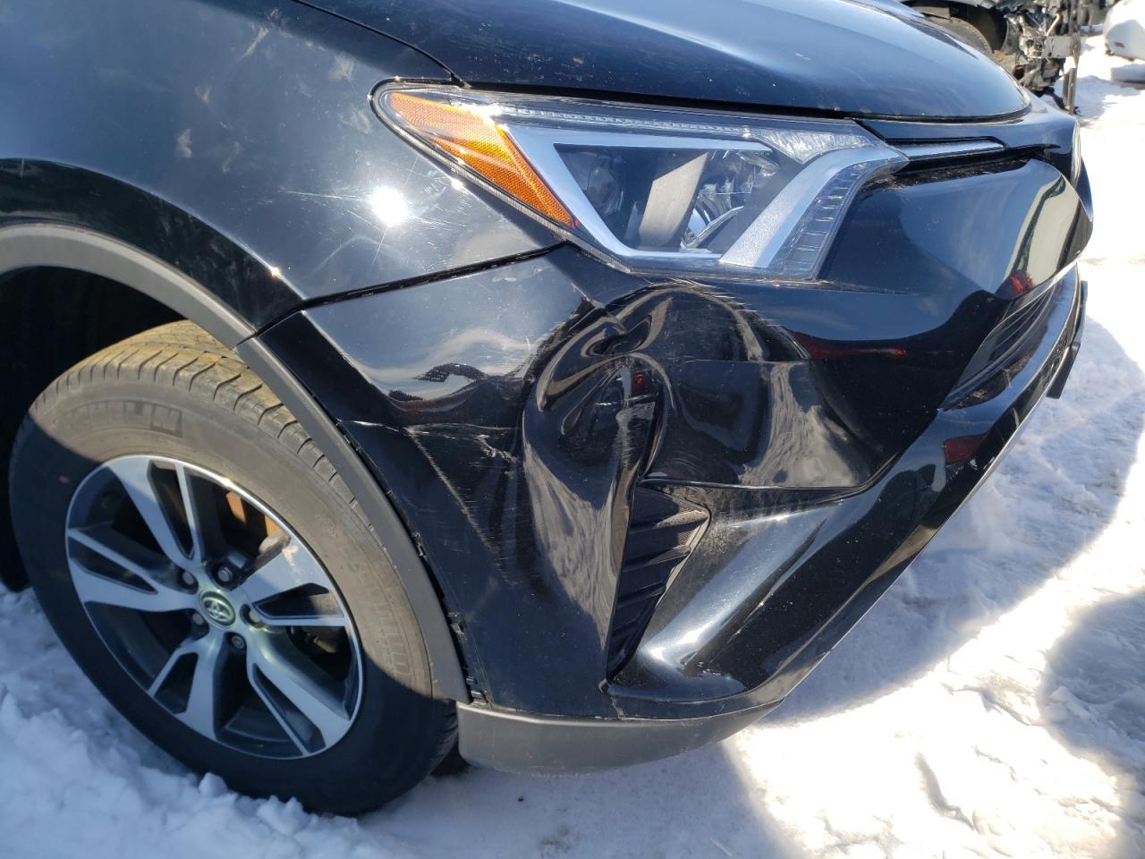 Photo 9 from auction – 2018 TOYOTA RAV4 LE with VIN 2T3ZFREV0JW407795