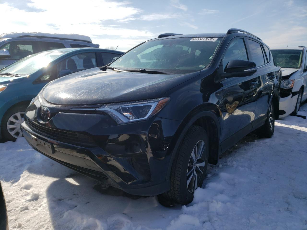 Photo 2 from auction – 2018 TOYOTA RAV4 LE with VIN 2T3ZFREV0JW407795