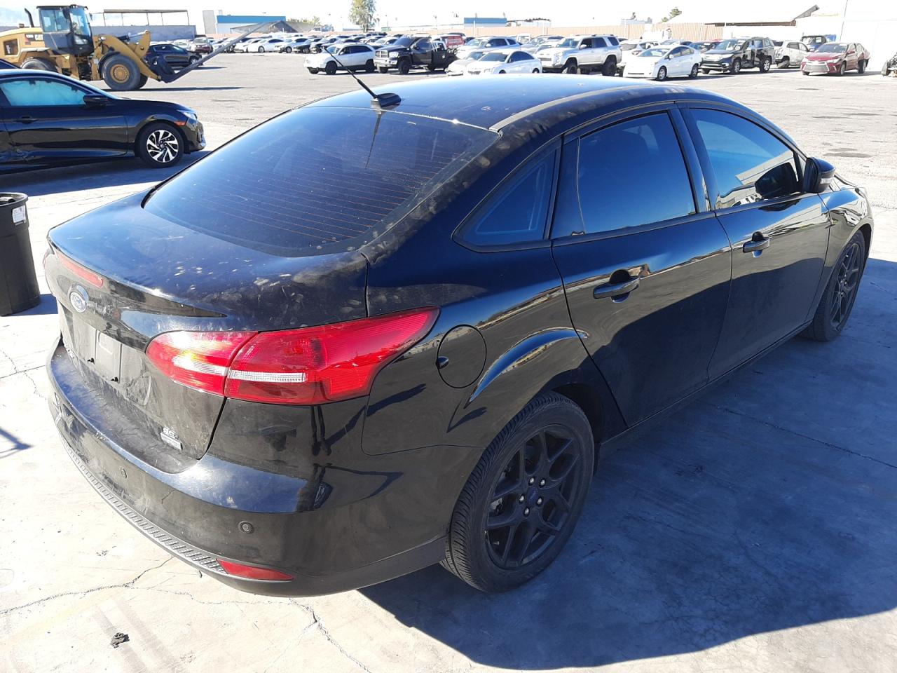 Photo 4 from auction – 2016 FORD FOCUS SE with VIN 1FADP3FE5GL315439